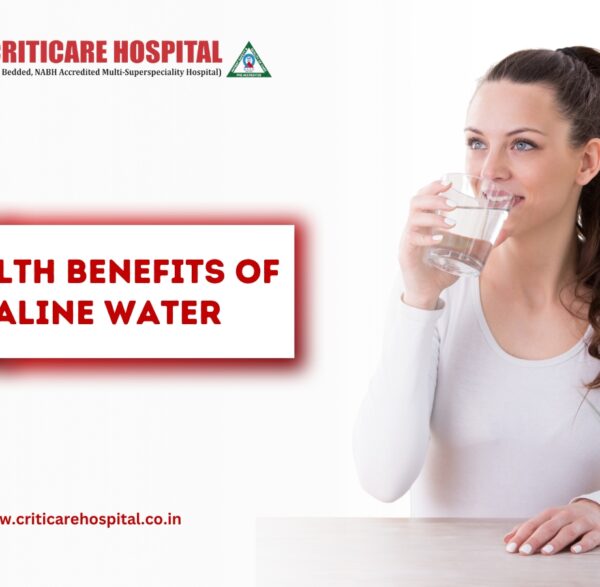 Woman drinking a glass of water with text “Health Benefits of Alkaline Water” on a Criticare Hospital banner.
