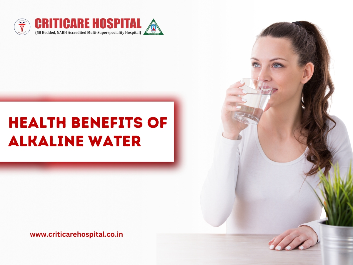 Woman drinking a glass of water with text “Health Benefits of Alkaline Water” on a Criticare Hospital banner.